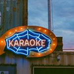 a large neon sign on the side of a building